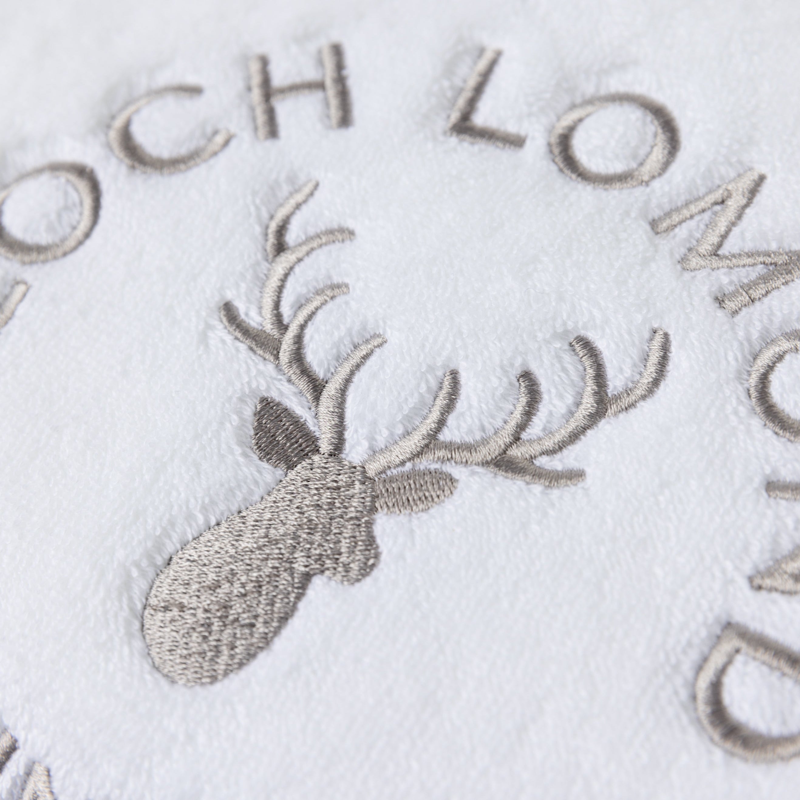 Macro photo of the Loch Lomond Linen logo embroidery
