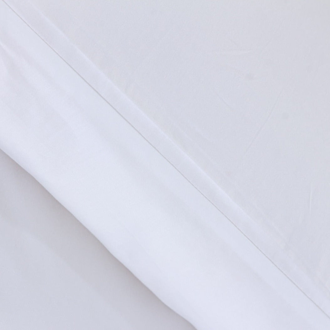 A close macro photo of Loch Lomond Linen's duvet cover showing the 400 thread count 100% cotton sateen material in detail.