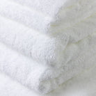 Close photo of the six piece white 100% cotton bath towel set showing how exceptional and detailed the quality is.