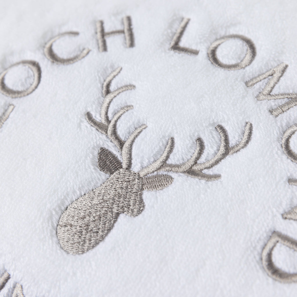 Macro photo of the Loch Lomond Linen logo embroidery