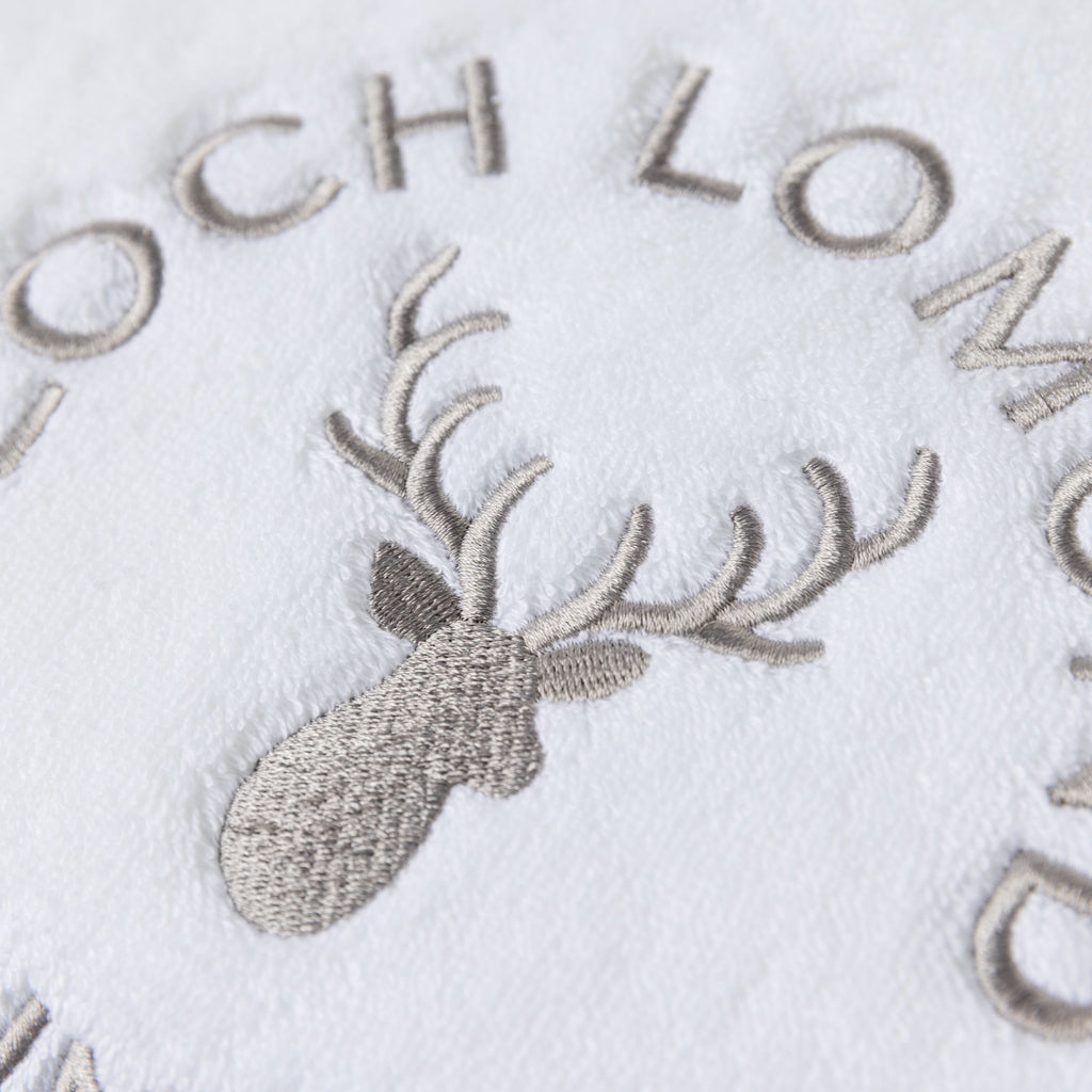 Macro photo of the Loch Lomond Linen logo embroidery