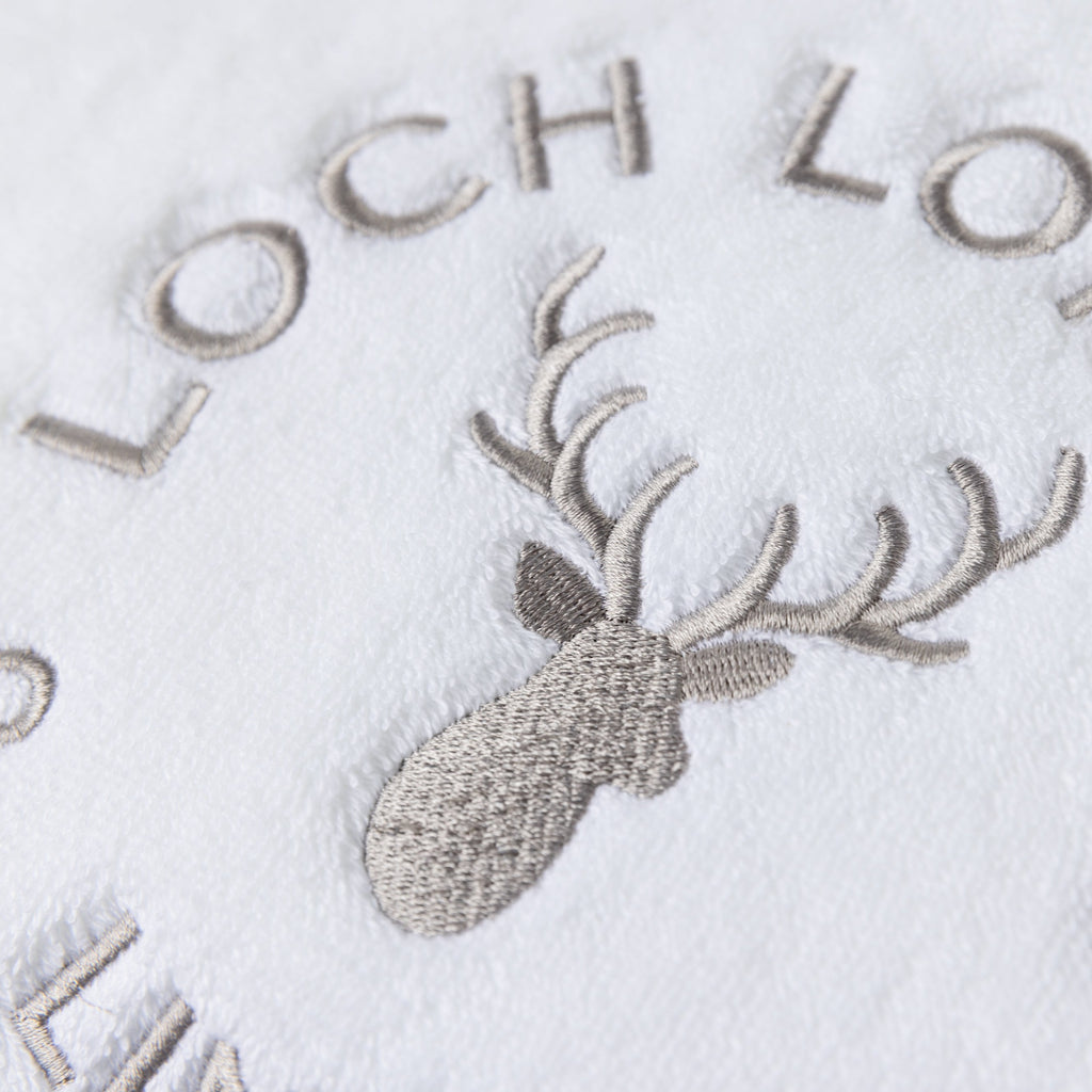 Macro photo of the Loch Lomond Linen logo embroidery