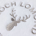 Macro photo of the Loch Lomond Linen logo embroidery