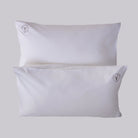 A pair of luxurious Housewife (envelope) pillowcases are shown with Loch Lomond Linen's logo embroidered in the corners. Made of 100% cotton sateen to ensure the best night's sleep.