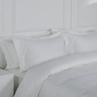 Loch Lomond LInen's elegant Oxford pillowcases are shown next to the duvet cover. The pillowcases are made of 100% cotton sateen.